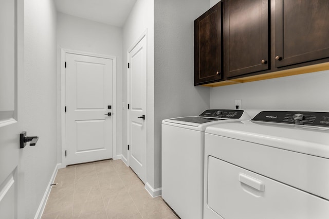 8450 Dreams Float Ct, Panama City Beach, FL 32413 - laundry room featuring cabinet space, separate washer and dryer, and light tile patterned floors