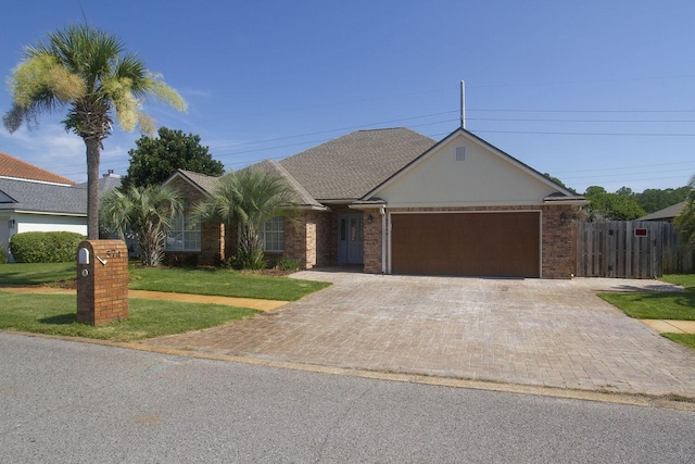 574 Avalon Blvd, Miramar Beach, FL 32550 - view of front of property featuring an attached garage, decorative driveway, and brick siding