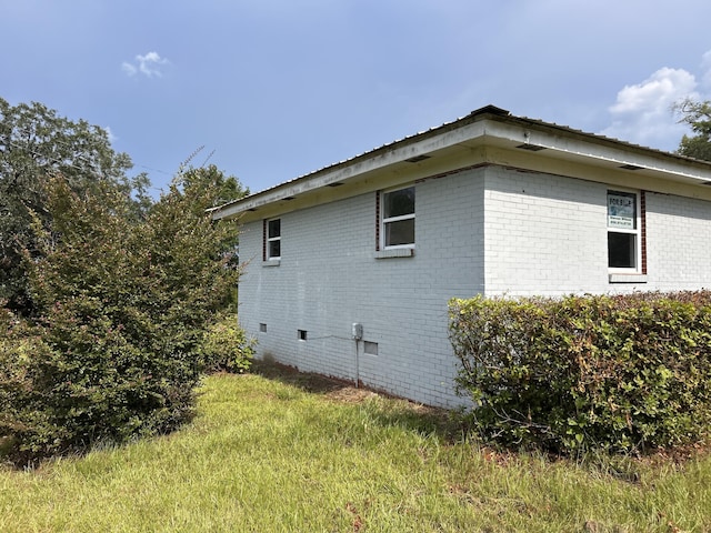2032 Brogdon St, Grand Ridge, FL 32442 - view of home's exterior with brick siding and crawl space