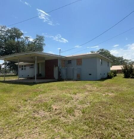 2032 Brogdon St, Grand Ridge, FL 32442 - back of property with a yard