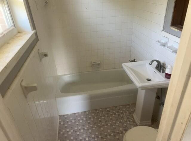 2032 Brogdon St, Grand Ridge, FL 32442 - full bath featuring bathing tub / shower combination and tile patterned floors