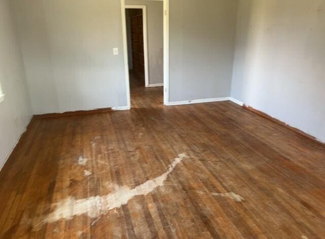 2032 Brogdon St, Grand Ridge, FL 32442 - unfurnished room featuring wood-type flooring and baseboards