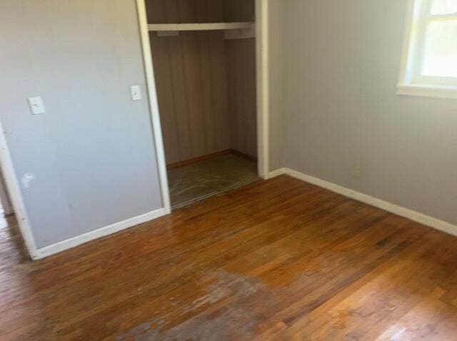 2032 Brogdon St, Grand Ridge, FL 32442 - unfurnished bedroom featuring a closet and wood finished floors