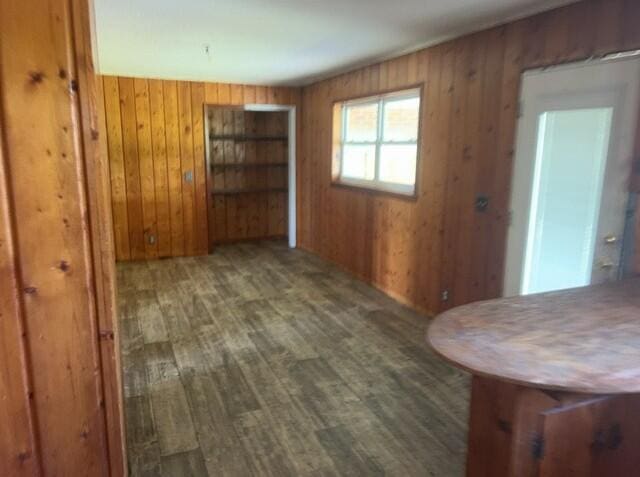 2032 Brogdon St, Grand Ridge, FL 32442 - unfurnished dining area featuring wood finished floors and wood walls