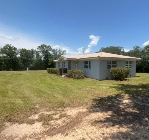 2032 Brogdon St, Grand Ridge, FL 32442 - back of property featuring a lawn