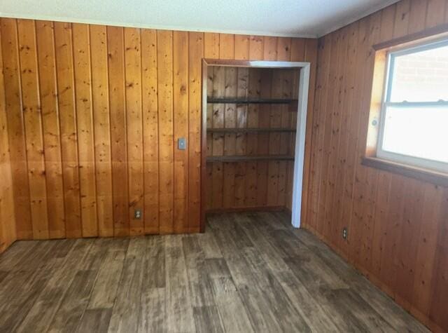 2032 Brogdon St, Grand Ridge, FL 32442 - unfurnished room featuring wood finished floors and wood walls
