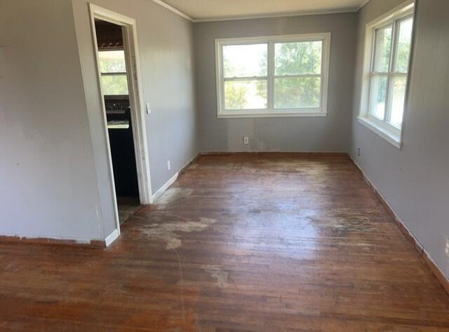 2032 Brogdon St, Grand Ridge, FL 32442 - spare room featuring wood finished floors and ornamental molding
