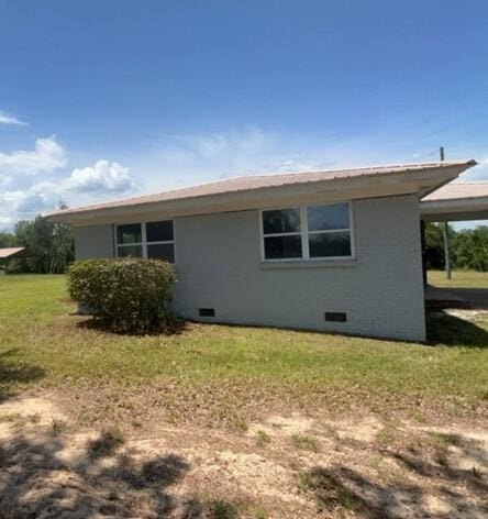 2032 Brogdon St, Grand Ridge, FL 32442 - view of property exterior featuring crawl space and a lawn