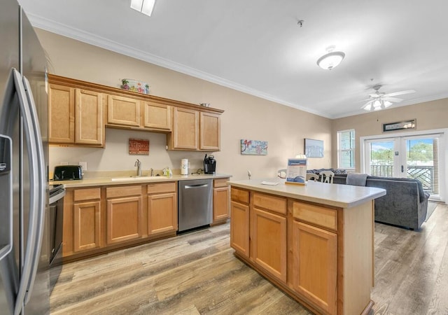 231 Somerset Bridge Rd Unit 2308, Santa Rosa Beach, FL 32459 - kitchen featuring stainless steel appliances, light wood finished floors, ornamental molding, open floor plan, and light countertops
