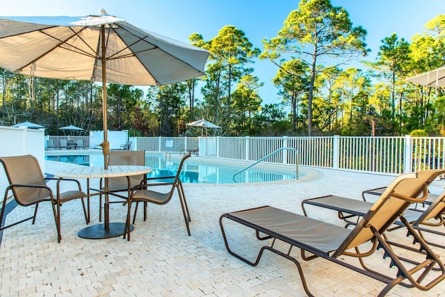 231 Somerset Bridge Rd Unit 2308, Santa Rosa Beach, FL 32459 - community pool with a patio area and view of wooded area