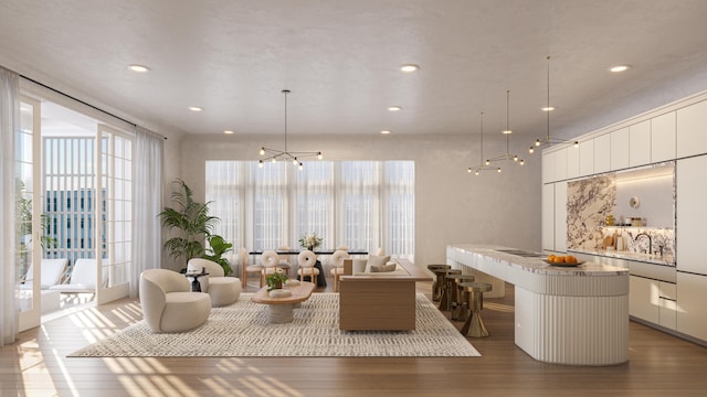62 S Somerset St, Inlet Beach, FL 32461 - living room with plenty of natural light, recessed lighting, wood finished floors, and a chandelier