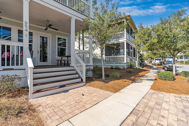 654 Flatwoods Forest Loop, Santa Rosa Beach, FL 32459 - view of exterior entry featuring a porch and ceiling fan