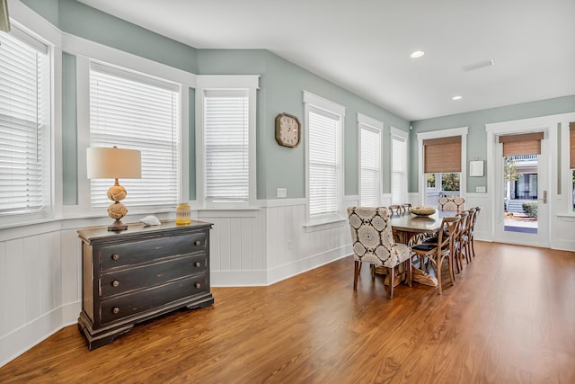 654 Flatwoods Forest Loop, Santa Rosa Beach, FL 32459 - dining area featuring wood finished floors, a decorative wall, wainscoting, and recessed lighting