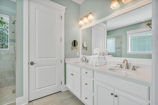 654 Flatwoods Forest Loop, Santa Rosa Beach, FL 32459 - bathroom featuring a stall shower, double vanity, and tile patterned flooring