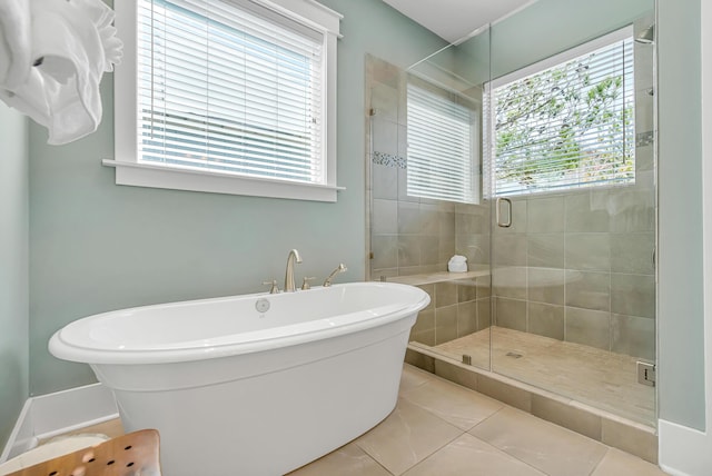 654 Flatwoods Forest Loop, Santa Rosa Beach, FL 32459 - bathroom with a soaking tub, a stall shower, and tile patterned floors