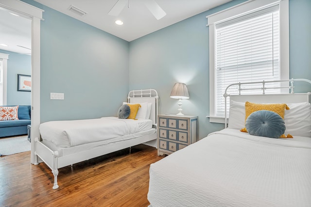654 Flatwoods Forest Loop, Santa Rosa Beach, FL 32459 - bedroom featuring wood finished floors, a ceiling fan, recessed lighting, and multiple windows