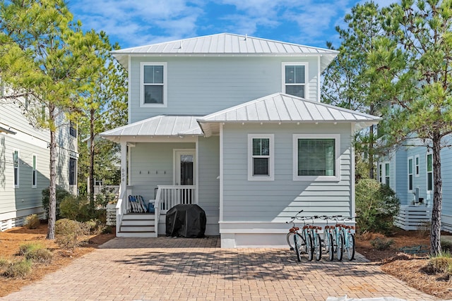 654 Flatwoods Forest Loop, Santa Rosa Beach, FL 32459 - view of front of home featuring a metal roof and a standing seam roof
