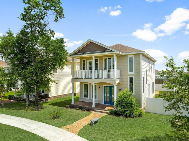 3929 Indian Springs Rd, Panama City, FL 32404 - view of front of home with a balcony, a porch, french doors, and a shingled roof