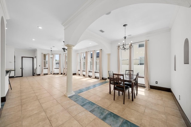 3929 Indian Springs Rd, Panama City, FL 32404 - dining area with ornate columns, ornamental molding, a chandelier, light tile patterned flooring, and arched walkways