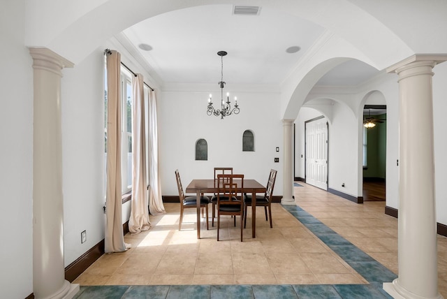 3929 Indian Springs Rd, Panama City, FL 32404 - dining space with ornamental molding, ceiling fan, arched walkways, ornate columns, and light tile patterned flooring