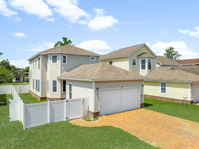 3929 Indian Springs Rd, Panama City, FL 32404 - back of property with a shingled roof, a garage, and decorative driveway