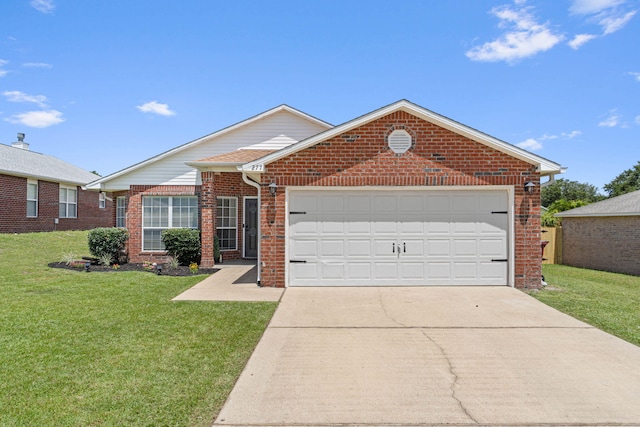 277 Limestone Cir, Crestview, FL 32539 - ranch-style house with concrete driveway, an attached garage, a front lawn, and brick siding