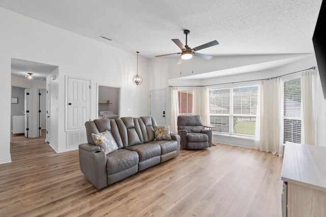 277 Limestone Cir, Crestview, FL 32539 - living area featuring ceiling fan, a textured ceiling, light wood finished floors, and high vaulted ceiling
