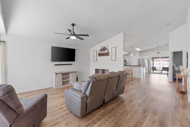 277 Limestone Cir, Crestview, FL 32539 - living area with vaulted ceiling, a ceiling fan, and light wood-type flooring