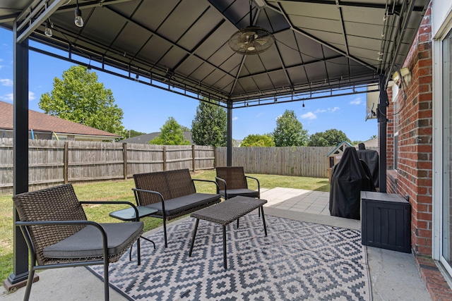 277 Limestone Cir, Crestview, FL 32539 - fenced backyard with grilling area, a patio, a gazebo, and ceiling fan
