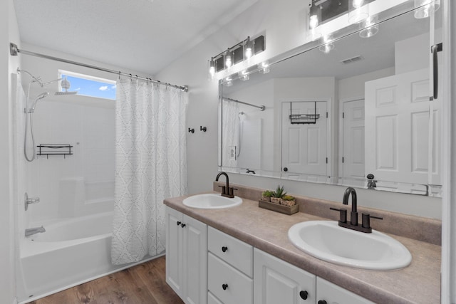 277 Limestone Cir, Crestview, FL 32539 - bathroom featuring shower / tub combo, double vanity, and wood finished floors