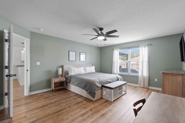 277 Limestone Cir, Crestview, FL 32539 - bedroom featuring light wood finished floors, a textured ceiling, and ceiling fan