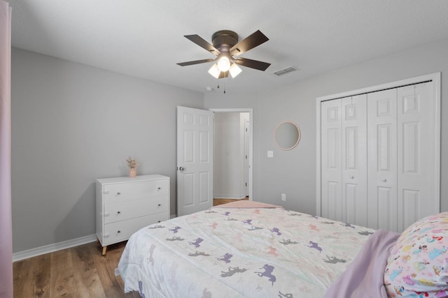 277 Limestone Cir, Crestview, FL 32539 - bedroom with a closet, wood finished floors, and a ceiling fan