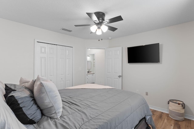 277 Limestone Cir, Crestview, FL 32539 - bedroom featuring wood finished floors, a closet, and a ceiling fan