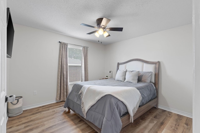 277 Limestone Cir, Crestview, FL 32539 - bedroom featuring light wood-style floors, a textured ceiling, and ceiling fan