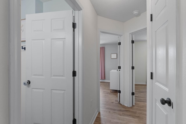 277 Limestone Cir, Crestview, FL 32539 - corridor with wood finished floors and a textured ceiling