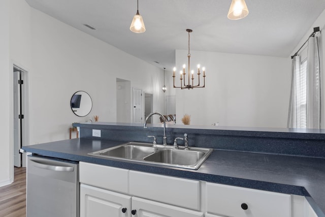 277 Limestone Cir, Crestview, FL 32539 - kitchen featuring dark countertops, dishwasher, white cabinets, wood finished floors, and pendant lighting