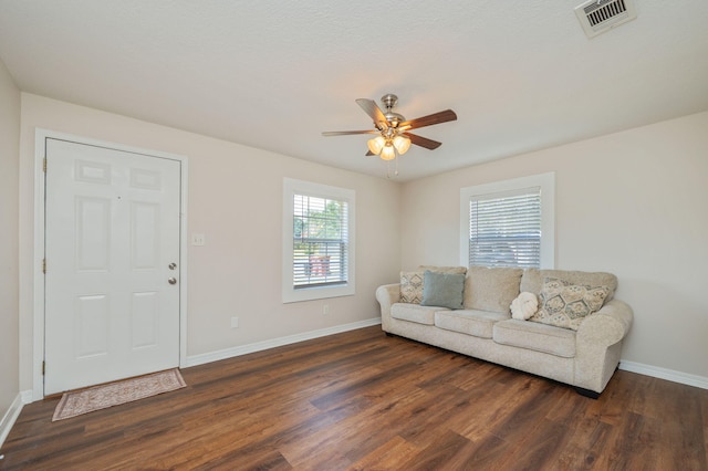 379 W 1st Ave, Crestview, FL 32536 - living area with dark wood-style floors and a ceiling fan