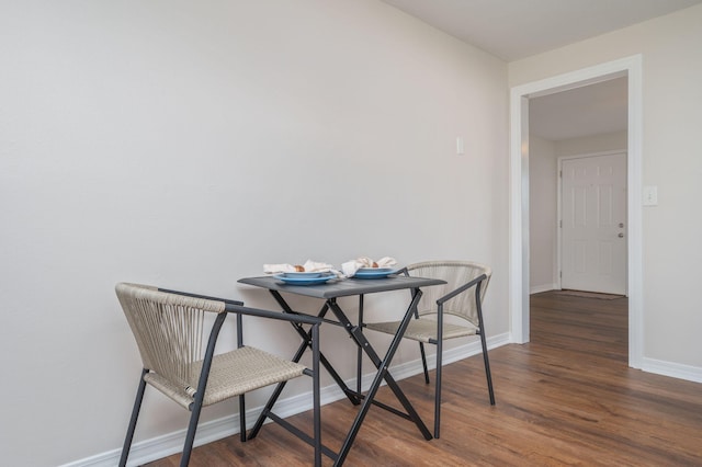 379 W 1st Ave, Crestview, FL 32536 - dining area featuring wood finished floors and baseboards