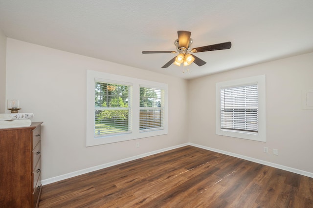 379 W 1st Ave, Crestview, FL 32536 - empty room featuring dark wood-style flooring and a ceiling fan
