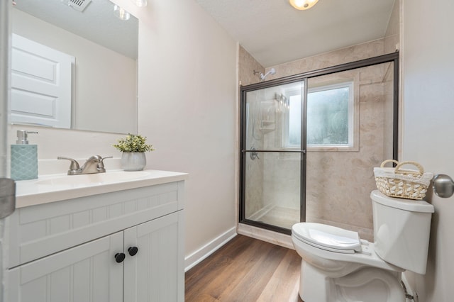 379 W 1st Ave, Crestview, FL 32536 - full bathroom with vanity, a shower stall, and wood finished floors
