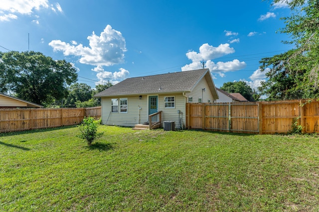 379 W 1st Ave, Crestview, FL 32536 - back of house featuring a fenced backyard and a shingled roof