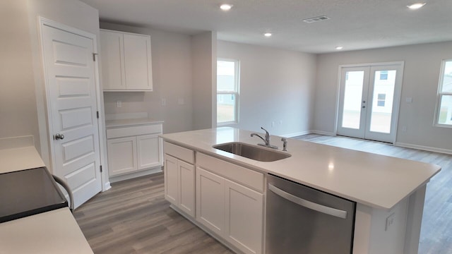 4408 Marine Loop, Crestview, FL 32539 - kitchen with dishwasher, light wood-style flooring, electric stove, white cabinets, and recessed lighting