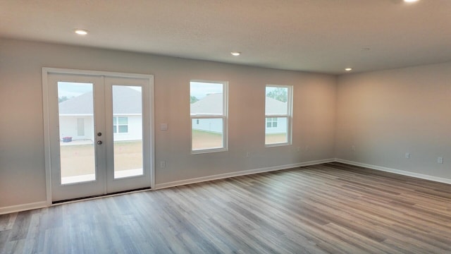 4408 Marine Loop, Crestview, FL 32539 - spare room featuring french doors, wood finished floors, and recessed lighting