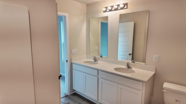 4408 Marine Loop, Crestview, FL 32539 - bathroom featuring double vanity and wood finished floors