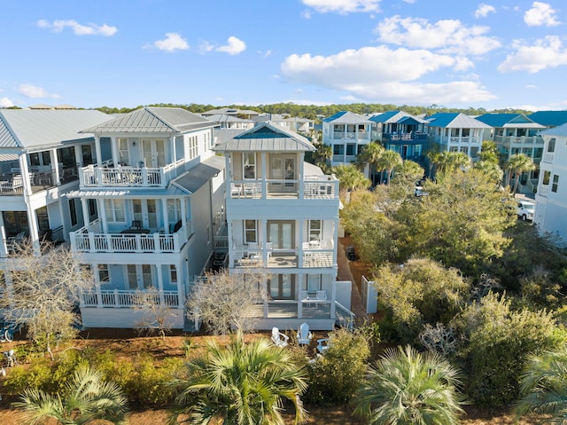 18 E Trigger Trl, Inlet Beach, FL 32461 - back of property featuring a balcony, french doors, and a residential view