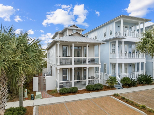18 E Trigger Trl, Inlet Beach, FL 32461 - view of front of house with a balcony, a porch, french doors, and a gate