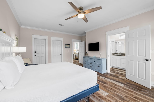 18 E Trigger Trl, Inlet Beach, FL 32461 - bedroom with dark wood finished floors, crown molding, connected bathroom, ceiling fan, and multiple closets