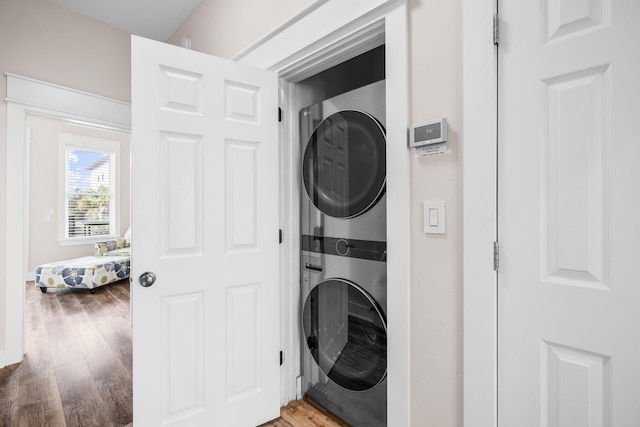 18 E Trigger Trl, Inlet Beach, FL 32461 - laundry area featuring stacked washer / dryer and light wood-type flooring