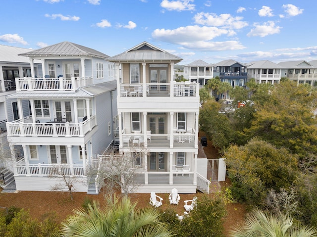 18 E Trigger Trl, Inlet Beach, FL 32461 - back of property featuring french doors, a balcony, and a residential view