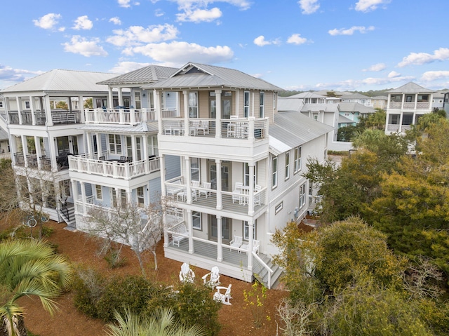 18 E Trigger Trl, Inlet Beach, FL 32461 - rear view of house featuring a metal roof